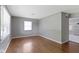 Bright living room with light gray walls, wood floors, and modern window at 255 N Pasadena Rd, Noblesville, IN 46062