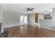 Open-concept living space with hardwood floors, stone fireplace, and sliding door access to outdoor patio at 255 N Pasadena Rd, Noblesville, IN 46062