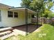 Backyard featuring a covered patio and a green lawn at 26 Crescent Ct, Chesterfield, IN 46017