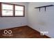 Bedroom featuring one window, a shelf, and hardwood floors at 26 Crescent Ct, Chesterfield, IN 46017