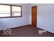 Small bedroom with a single window and carpet flooring at 26 Crescent Ct, Chesterfield, IN 46017