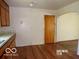 Traditional kitchen with wood cabinets, light countertops, and hardwood floors at 26 Crescent Ct, Chesterfield, IN 46017