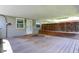 Covered back patio with wood deck, featuring access to backyard and exterior amenities at 267 S Grant Ave, Indianapolis, IN 46201