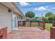 Home features a back deck that overlooks a verdant lawn and the neighboring houses at 2908 N Routiers Ave, Indianapolis, IN 46219