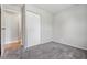 Bedroom featuring carpet and a closet with window offering exterior view at 2908 N Routiers Ave, Indianapolis, IN 46219