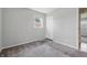 Bedroom featuring carpet and a closet for storage with a window and light walls at 2908 N Routiers Ave, Indianapolis, IN 46219
