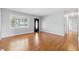 Inviting living room showcasing gleaming hardwood floors, neutral wall color, and natural light at 2908 N Routiers Ave, Indianapolis, IN 46219