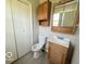 A bathroom features a cabinet and sink with an oak vanity and a shower and tub combo at 3106 Southwest Dr, Indianapolis, IN 46241
