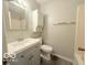 A cozy bathroom featuring a single sink vanity, toilet, and shower and tub combo at 3106 Southwest Dr, Indianapolis, IN 46241