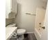 A bathroom featuring a single sink vanity, toilet, and shower and tub combo at 3106 Southwest Dr, Indianapolis, IN 46241