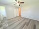 A secondary bedroom features ample space with a ceiling fan and large closet at 3106 Southwest Dr, Indianapolis, IN 46241