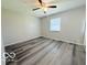 A secondary bedroom features ample space with a ceiling fan and window at 3106 Southwest Dr, Indianapolis, IN 46241