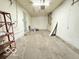 Large garage with concrete floors and door leading to the outside at 3106 Southwest Dr, Indianapolis, IN 46241