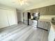 Kitchen featuring stainless steel appliances and ample cabinet space at 3106 Southwest Dr, Indianapolis, IN 46241