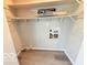 Bright laundry room showing hookups and wire shelving at 3106 Southwest Dr, Indianapolis, IN 46241