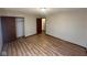 Bedroom featuring updated floors, a closet with sliding doors and an entrance to another room at 3155 Roseway Dr, Indianapolis, IN 46226