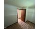 Cozy bedroom featuring updated floors, neutral walls, and access to the hallway at 3155 Roseway Dr, Indianapolis, IN 46226
