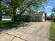 Charming ranch-style home with an elongated front porch and a long driveway at 3155 Roseway Dr, Indianapolis, IN 46226