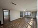 Open living room with updated floors, slider to backyard, and great natural light, perfect for entertaining or relaxing at 3155 Roseway Dr, Indianapolis, IN 46226