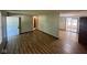Open-concept living area with vinyl floors, neutral walls, and a view to dining room at 3155 Roseway Dr, Indianapolis, IN 46226