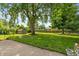 Large backyard with a storage shed and mature trees, creating a peaceful outdoor space at 3225 25Th St, Columbus, IN 47203