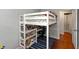 Playful bedroom features a loft bed, desk area, and open space at 3225 25Th St, Columbus, IN 47203