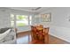 Bright dining area with hardwood floors, table with seating, and large window view at 3225 25Th St, Columbus, IN 47203