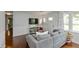 Inviting living room with hardwood floors, a comfortable couch, and a front entry door at 3225 25Th St, Columbus, IN 47203
