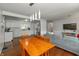 Open-concept layout with a dining area and living space featuring hardwood floors at 3225 25Th St, Columbus, IN 47203