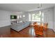 Open-concept living and dining area with large windows and stylish decor at 3225 25Th St, Columbus, IN 47203