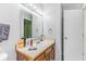 Bathroom with white sink, wood vanity, and standard lighting at 3620 N Lakeside Dr, Muncie, IN 47304