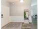 Welcoming entryway with coat rack, stylish rug, and modern accents for a great first impression at 3620 N Lakeside Dr, Muncie, IN 47304