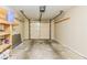 Spacious garage with room for storage, garage door opener, and shelving at 3620 N Lakeside Dr, Muncie, IN 47304