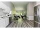Open concept featuring kitchen, dining, and living room with fireplace at 3620 N Lakeside Dr, Muncie, IN 47304