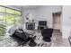 Living room with gas fireplace, and black accent chair at 3620 N Lakeside Dr, Muncie, IN 47304