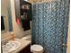 Well-lit bathroom featuring a tiled shower, a vanity with ample storage, and a coordinated color scheme at 3861 Indigo Blue Blvd, Whitestown, IN 46075