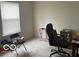 Bedroom features a large window offering natural light, with a work station and neutral carpeting at 3861 Indigo Blue Blvd, Whitestown, IN 46075
