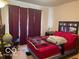 Cozy bedroom with a comfortable bed, soft lighting, and a window with privacy curtains at 3861 Indigo Blue Blvd, Whitestown, IN 46075