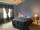 Calming bedroom with blue walls, draped windows, and carpeted floors at 3861 Indigo Blue Blvd, Whitestown, IN 46075