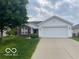 Ranch home with a brick accent, a two-car garage, and a well-manicured lawn at 3861 Indigo Blue Blvd, Whitestown, IN 46075