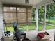 Screened-in porch with comfortable seating, ideal for enjoying the outdoors without the bugs at 3861 Indigo Blue Blvd, Whitestown, IN 46075