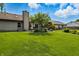 Spacious backyard with a large grassy area and patio, perfect for outdoor activities at 3916 St Simons Ct, Indianapolis, IN 46237