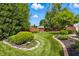 Picturesque backyard featuring a well-manicured lawn and a privacy fence with garden shed at 3916 St Simons Ct, Indianapolis, IN 46237