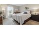 Cozy bedroom with a comfortable bed, a piano, a window, and a bedside table, creating a tranquil retreat at 3916 St Simons Ct, Indianapolis, IN 46237