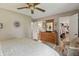 Comfortable bedroom featuring a ceiling fan, dresser, and an open doorway to an organized walk-in closet at 3916 St Simons Ct, Indianapolis, IN 46237
