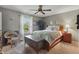 Cozy bedroom with natural light, a ceiling fan, and a comfortable bed at 3916 St Simons Ct, Indianapolis, IN 46237