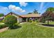 Inviting single-story house with a lush green lawn and mature landscaping at 3916 St Simons Ct, Indianapolis, IN 46237