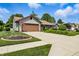 Well-maintained home with a long driveway and beautiful front yard with tasteful landscaping at 3916 St Simons Ct, Indianapolis, IN 46237