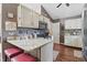 Kitchen area with updated appliances, light countertops and a convenient breakfast bar at 3916 St Simons Ct, Indianapolis, IN 46237