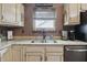 Kitchen area featuring modern appliances, stainless steel sink, and granite countertops at 3916 St Simons Ct, Indianapolis, IN 46237